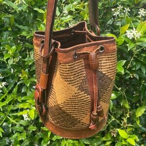 Woven leather and cane bucket bag